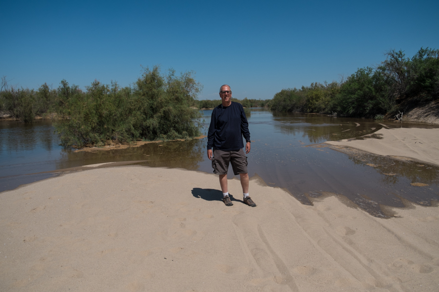Standing in the bed of the Colorado River north of the San Luis Bridge, looking upstream at the advancing water, March 25, 2014. Juan Hernandez took this picture of me