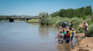 UNM water resources students measuring the Rio Grande