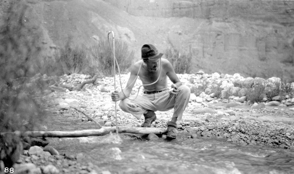 Grand Canyon National Park, Arizona.E.C. LaRue measuring the discharge of Nankoweap Creek. Every stream adjoining the Colorado River in the Grand Canyon region was measured. August 12, 1923. Colorado River Survey of 1923 (Birdseye).