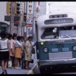 People board a city bus in downtown Albuquerque, Water McDonald, 1969, courtesy Albuquerque Museum, object number PA1996.006.036