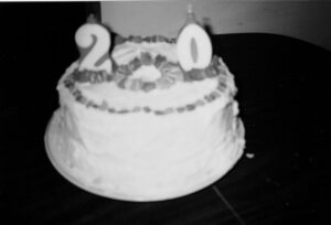 Black and white photo of a 20th birthday cake.